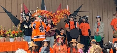 Chief Chappell (Left) Councillor Joanne Charles centre, Terry Teegee, Regional Chief of BC Assembly of First Nations. Children in the front were some of the dancers.